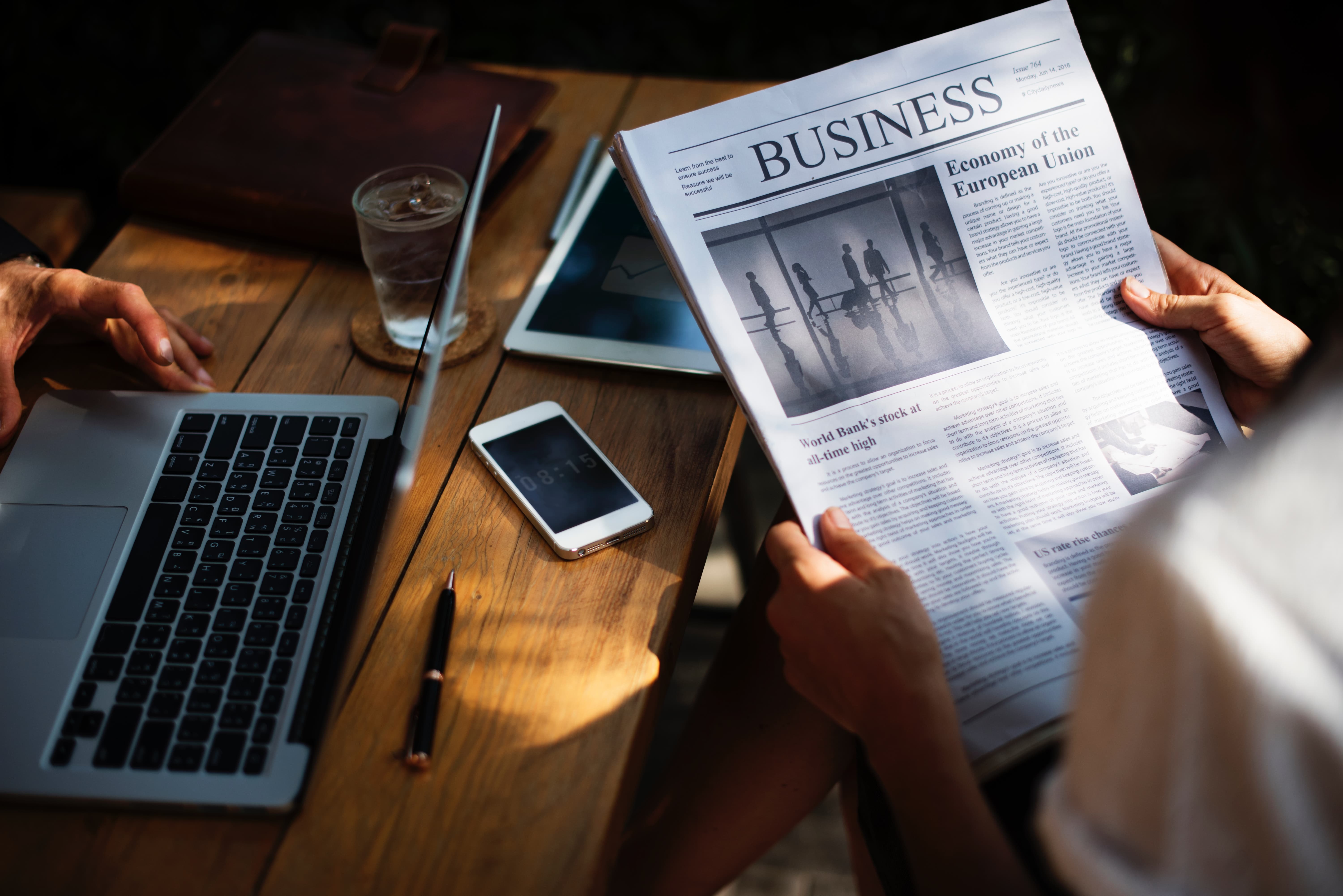 Person reading newspaper